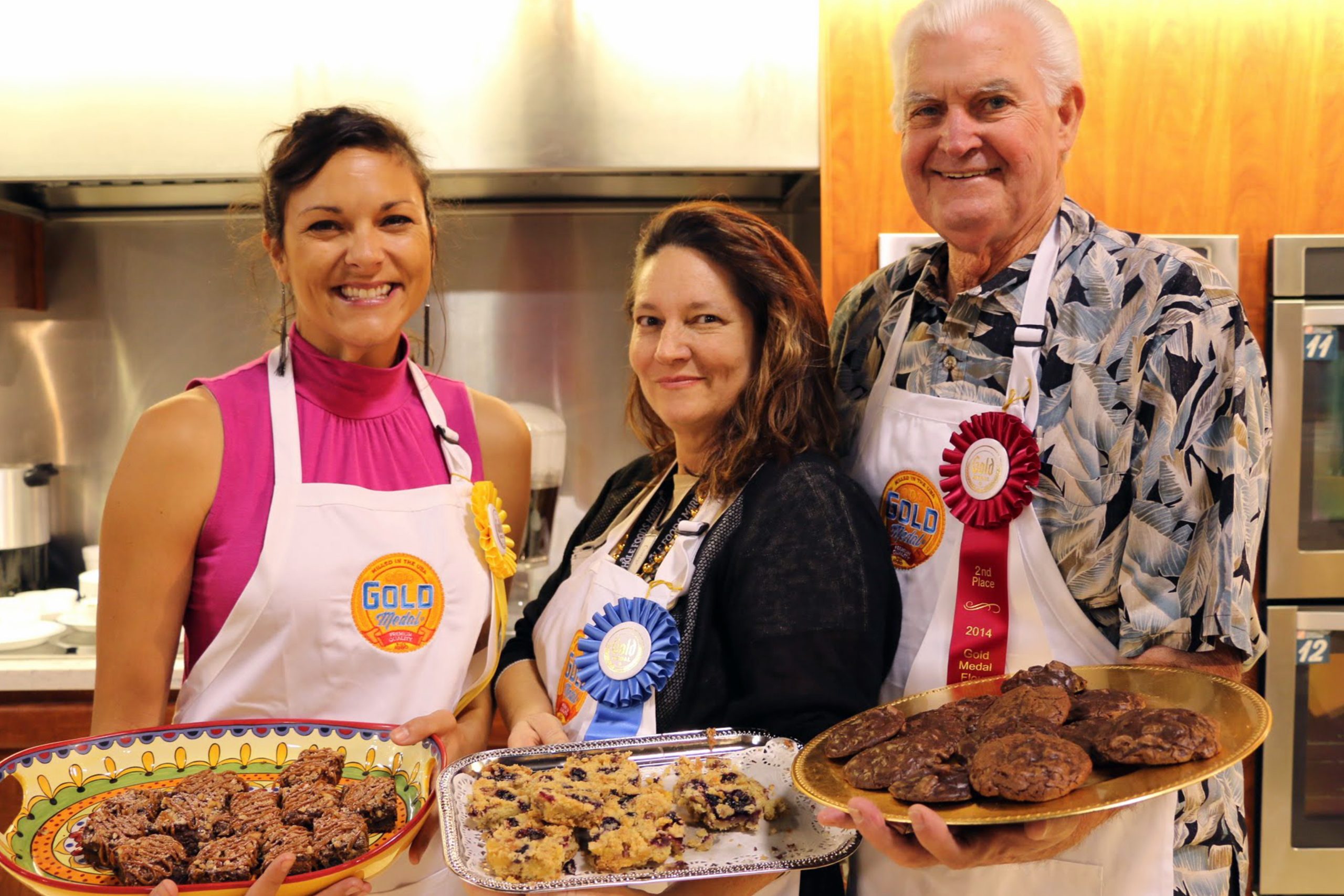 winners of baking competition at the State Fair of Texas with their winning items, wearing their ribbons