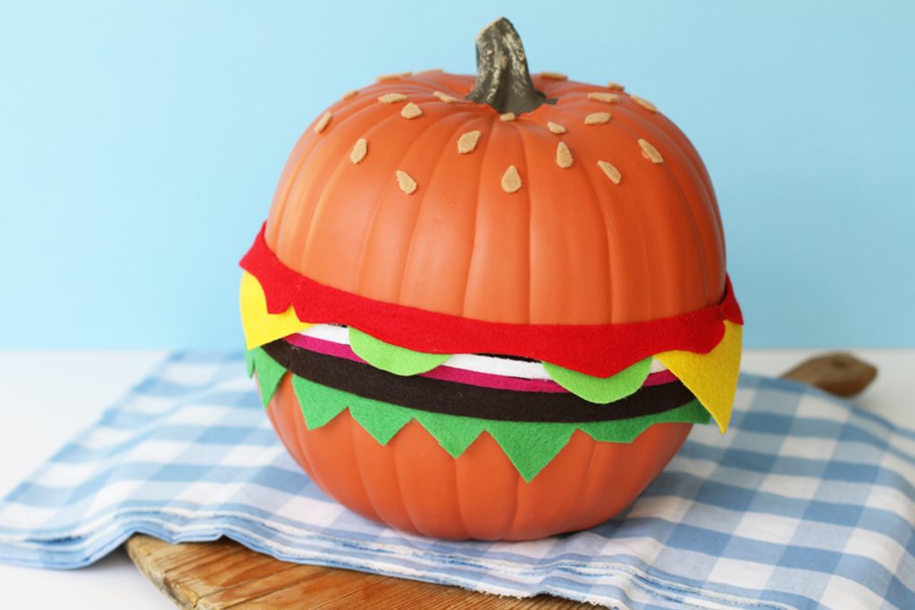 pumpkin decorated as a cheeseburger using felt