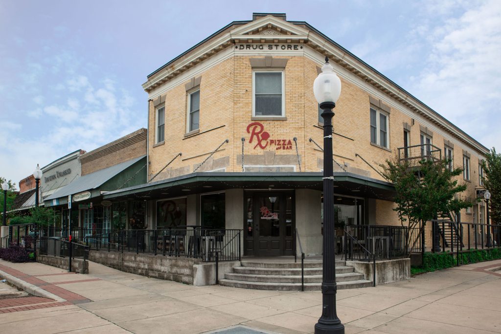 old corner building that is occupied by Rose Pizza and Bar in downtown Bryan