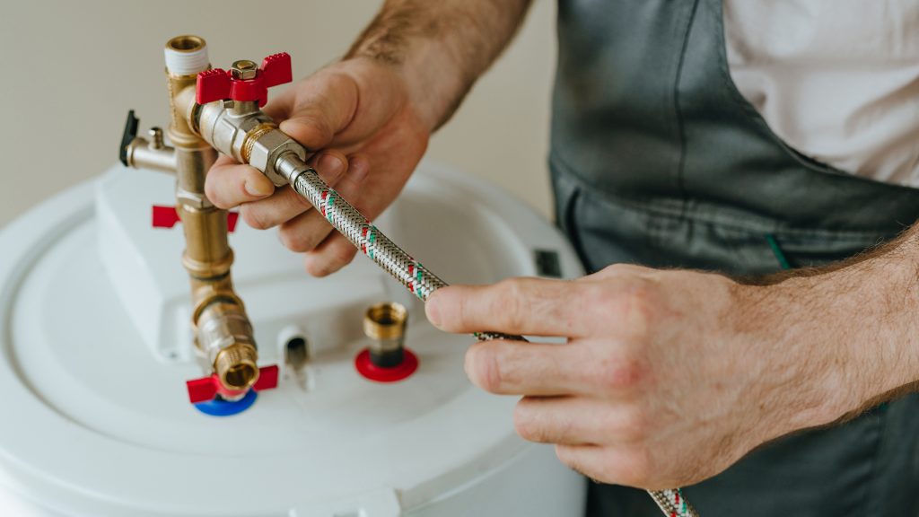 Man adjusting gas line.