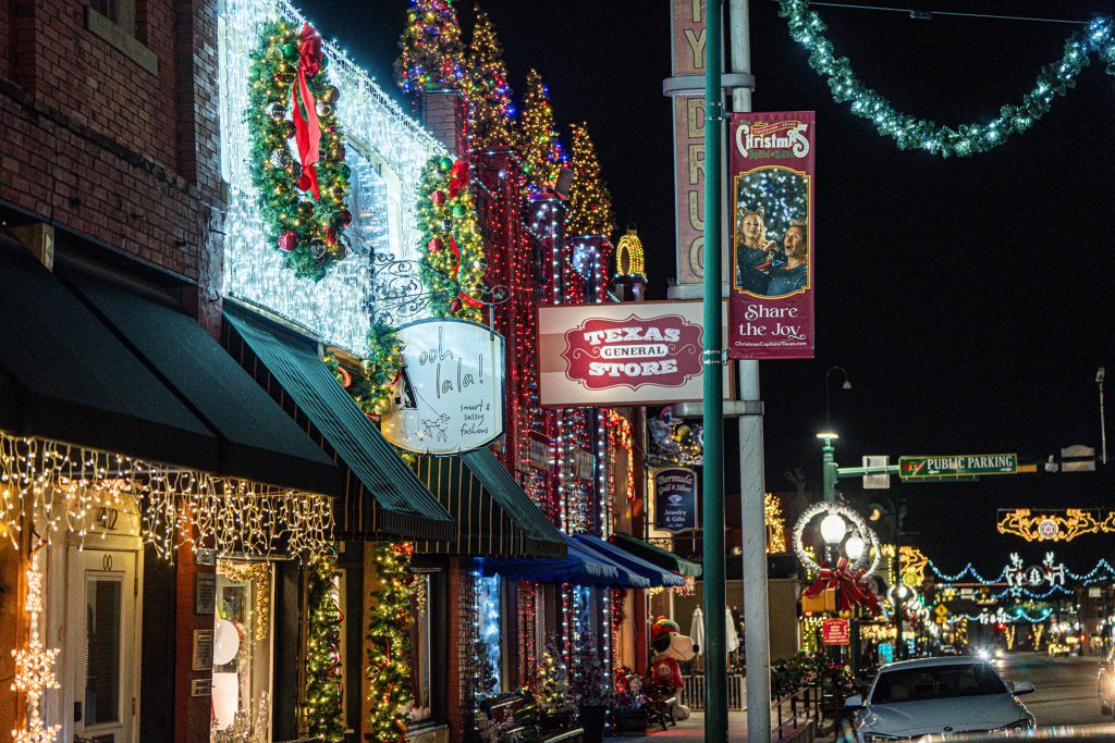 Shopping street decked out in Christmas lights and decorations.