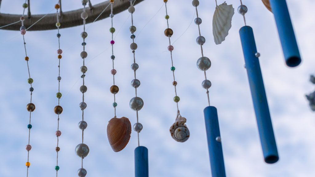 Wind chime made from beads and shells.