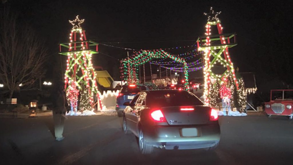 Drive-through nativity scene and holiday lights.