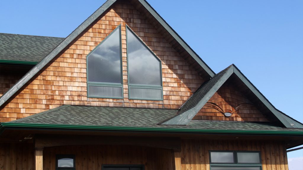 Exterior of house with big windows.