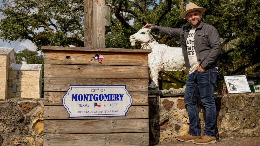 Chet Garner standing in front of Montgomery city sign.