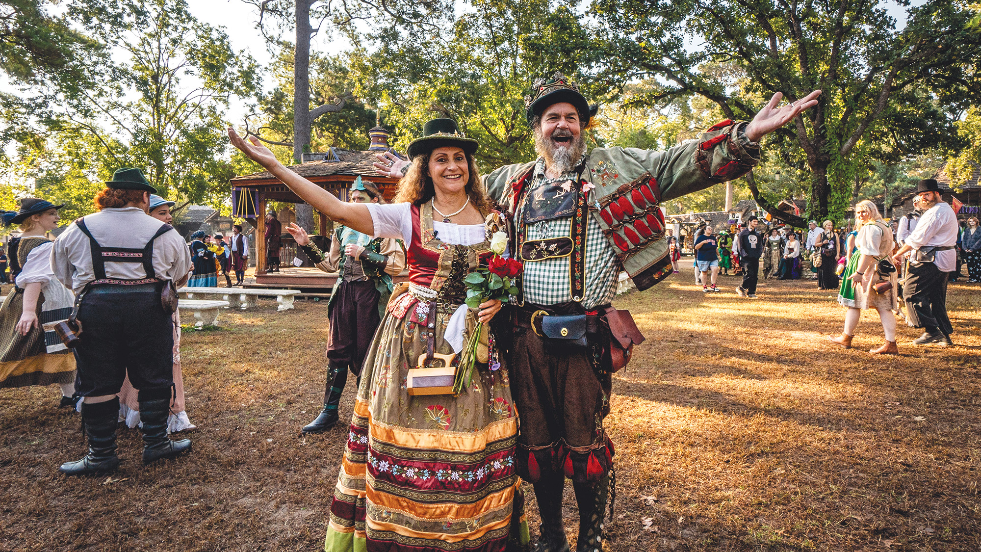 A man and a woman dressed in renaissance attire at a Ren fest.