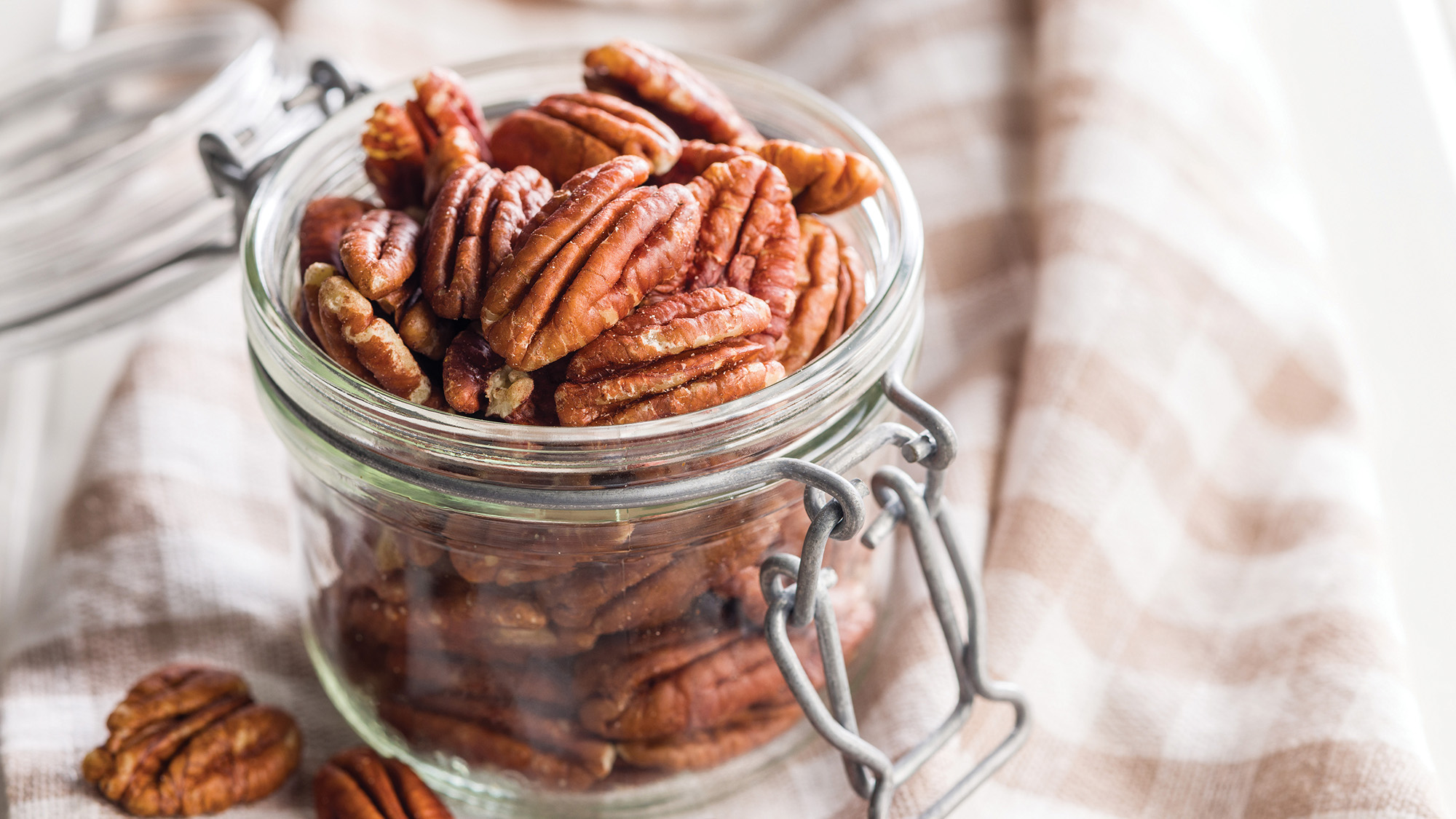 Mason jar of shelled pecans.
