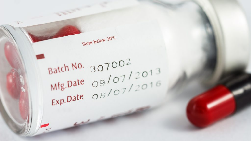 Prescription medication bottle with dates.