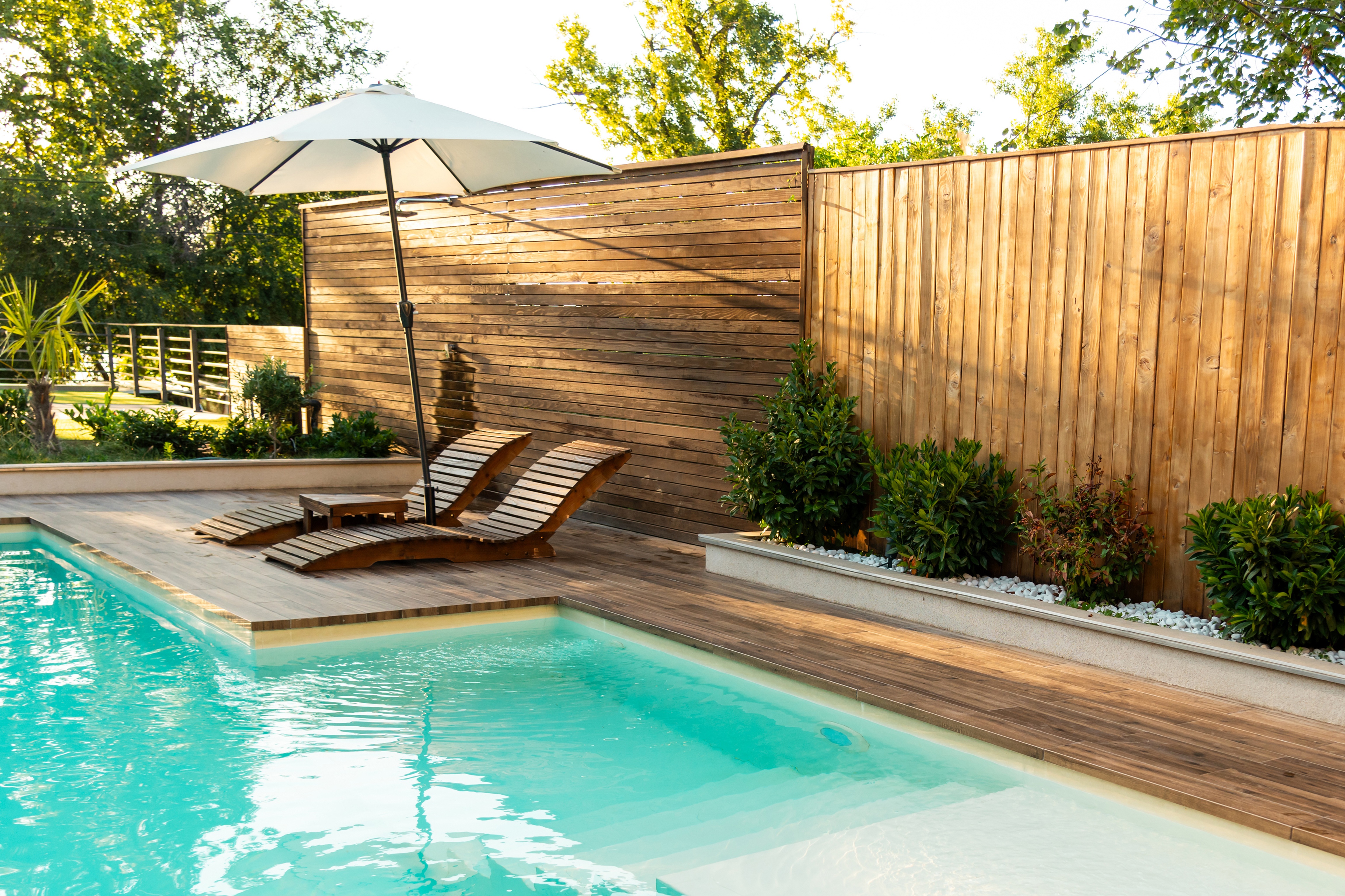 Pool with wooden deck.