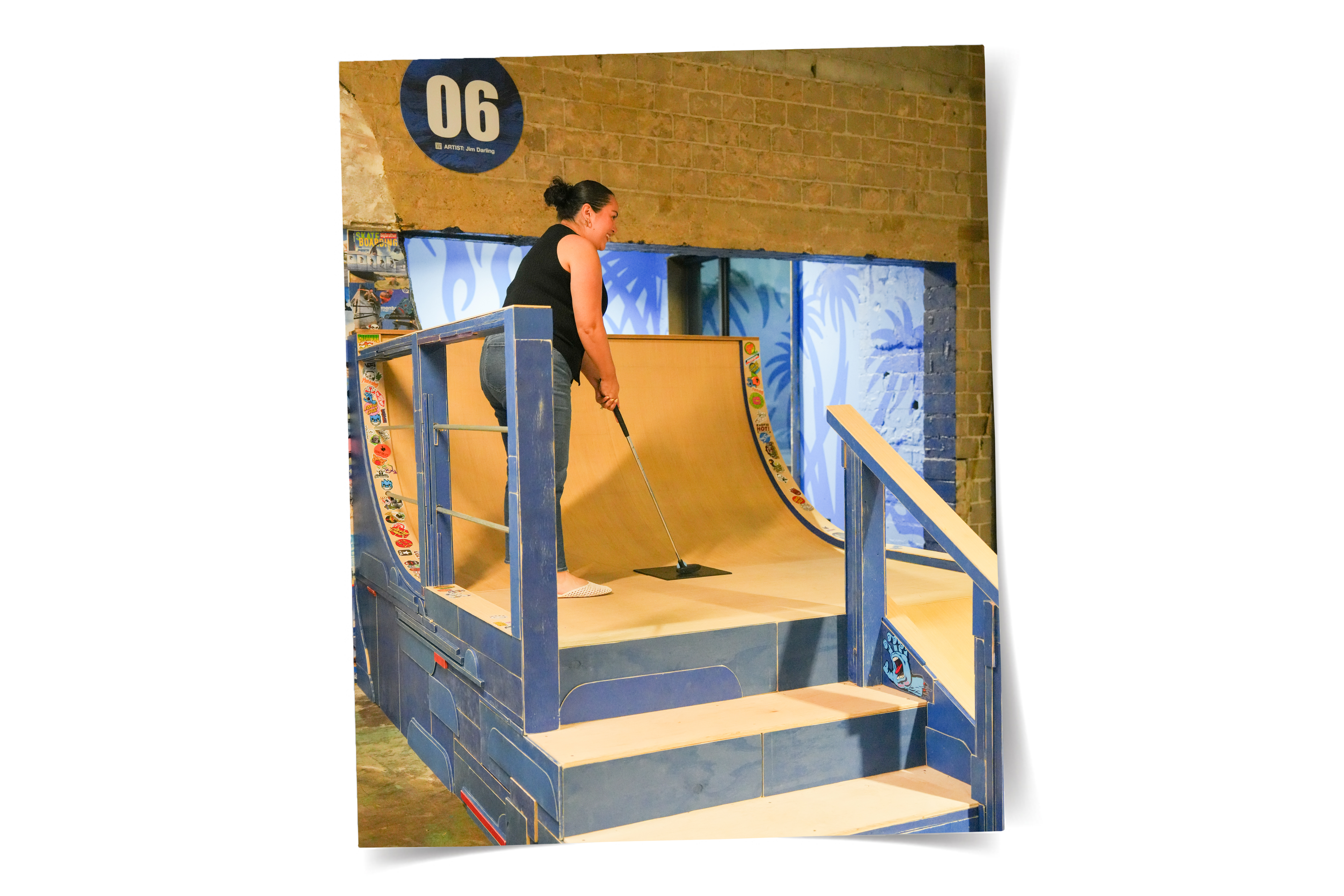 Woman playing mini golf.