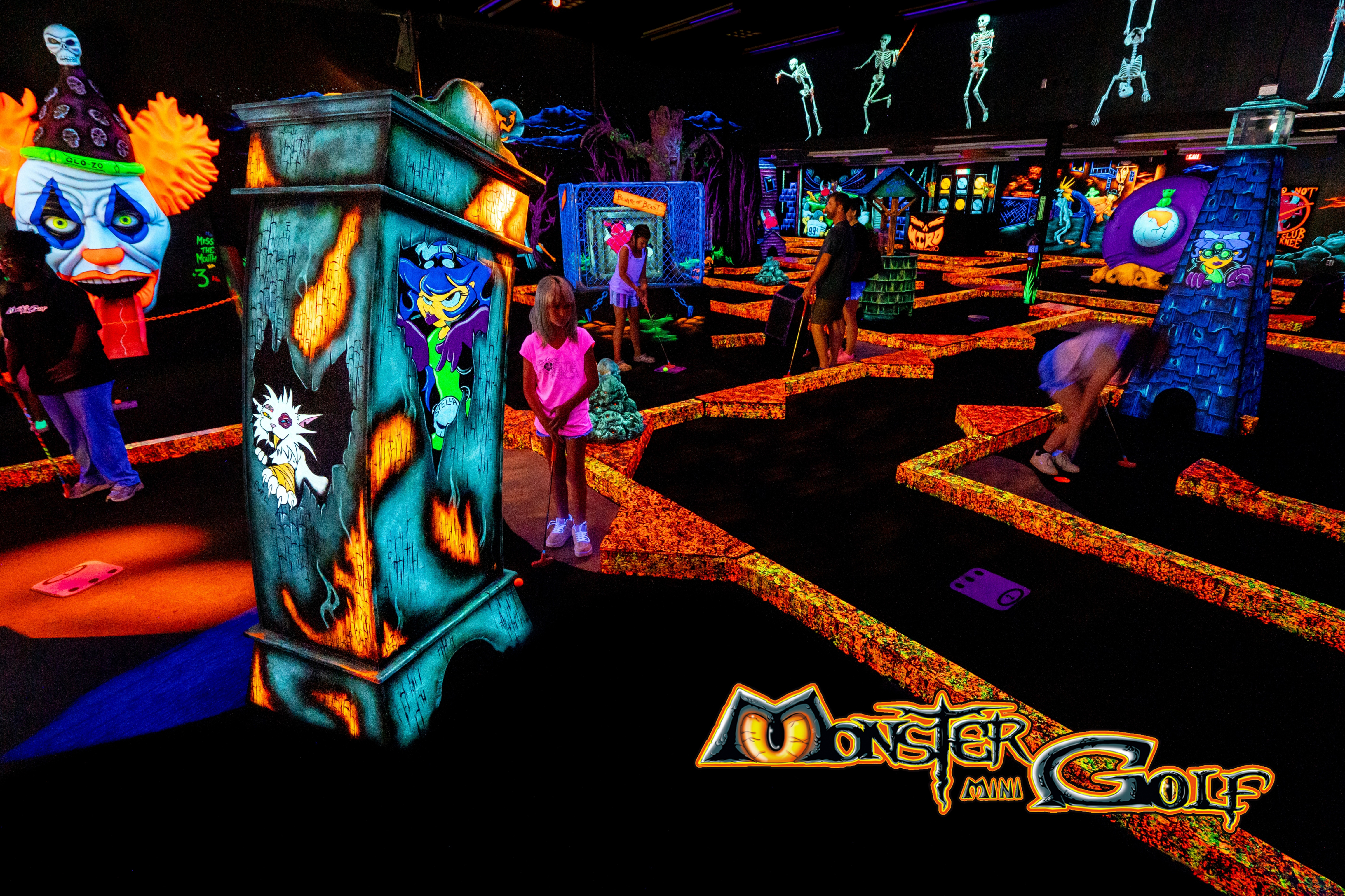 Monster Mini Golf course that's glowing in the dark.