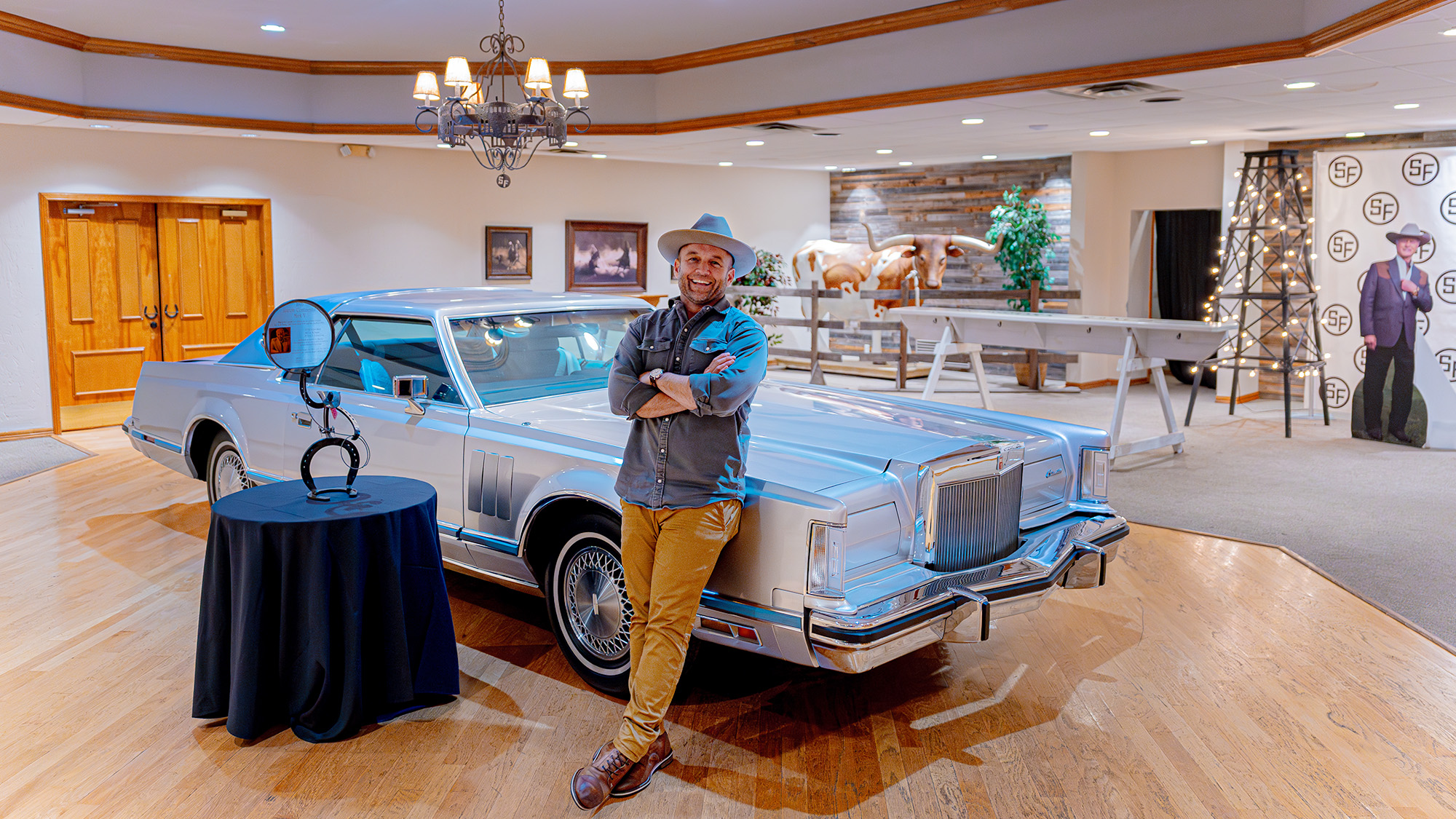 Chet Garner in front of car.