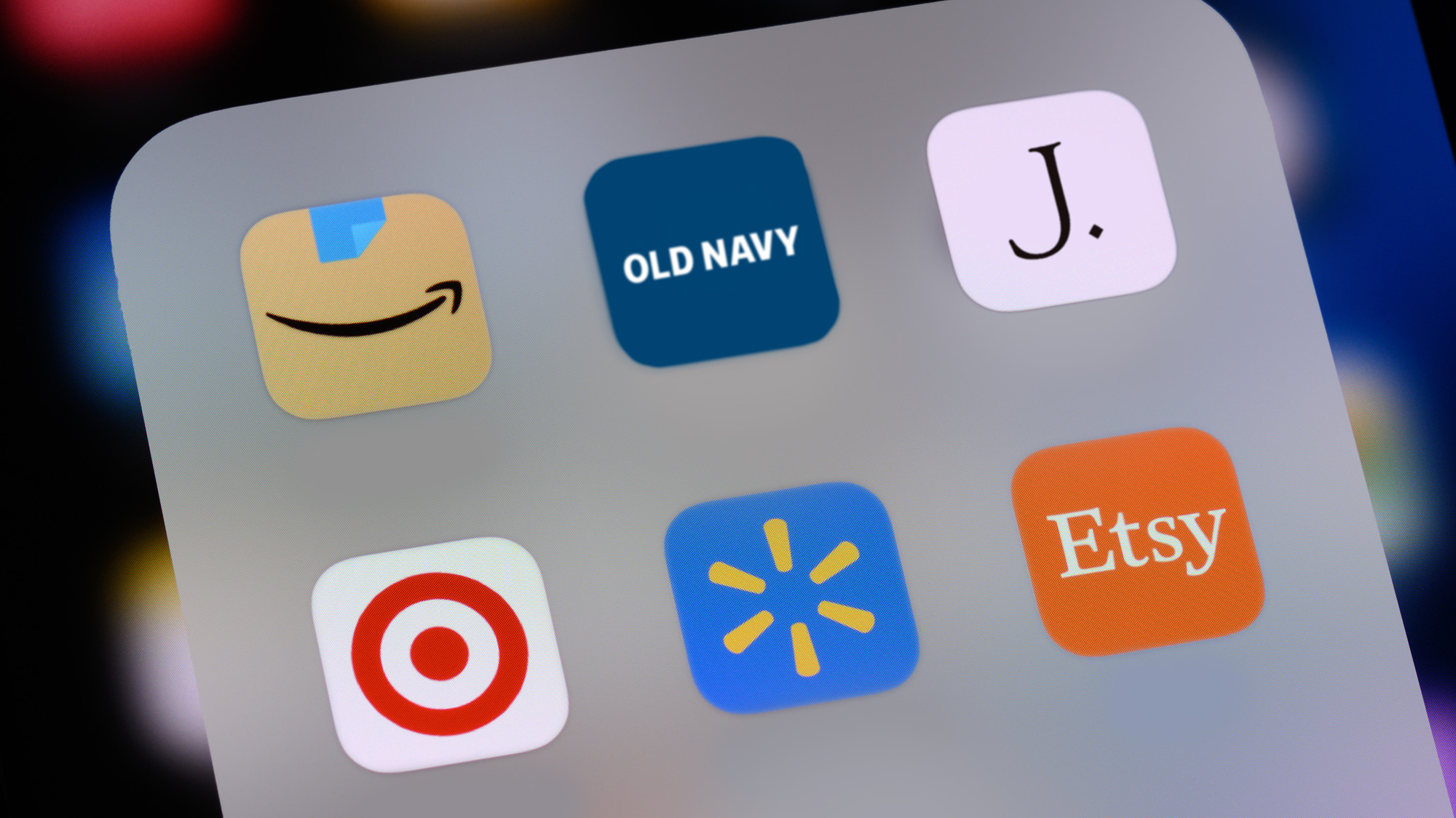 Phone screen with shopping apps on them.