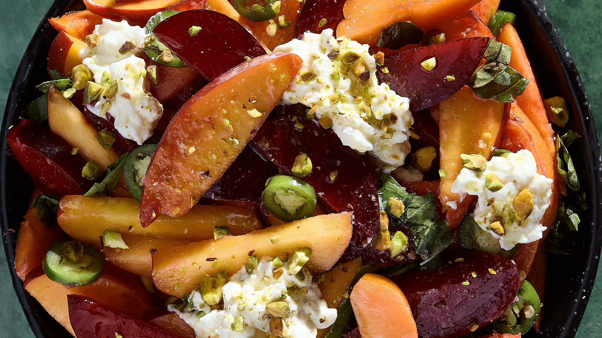Peach, burrata, and pistachio salad.
