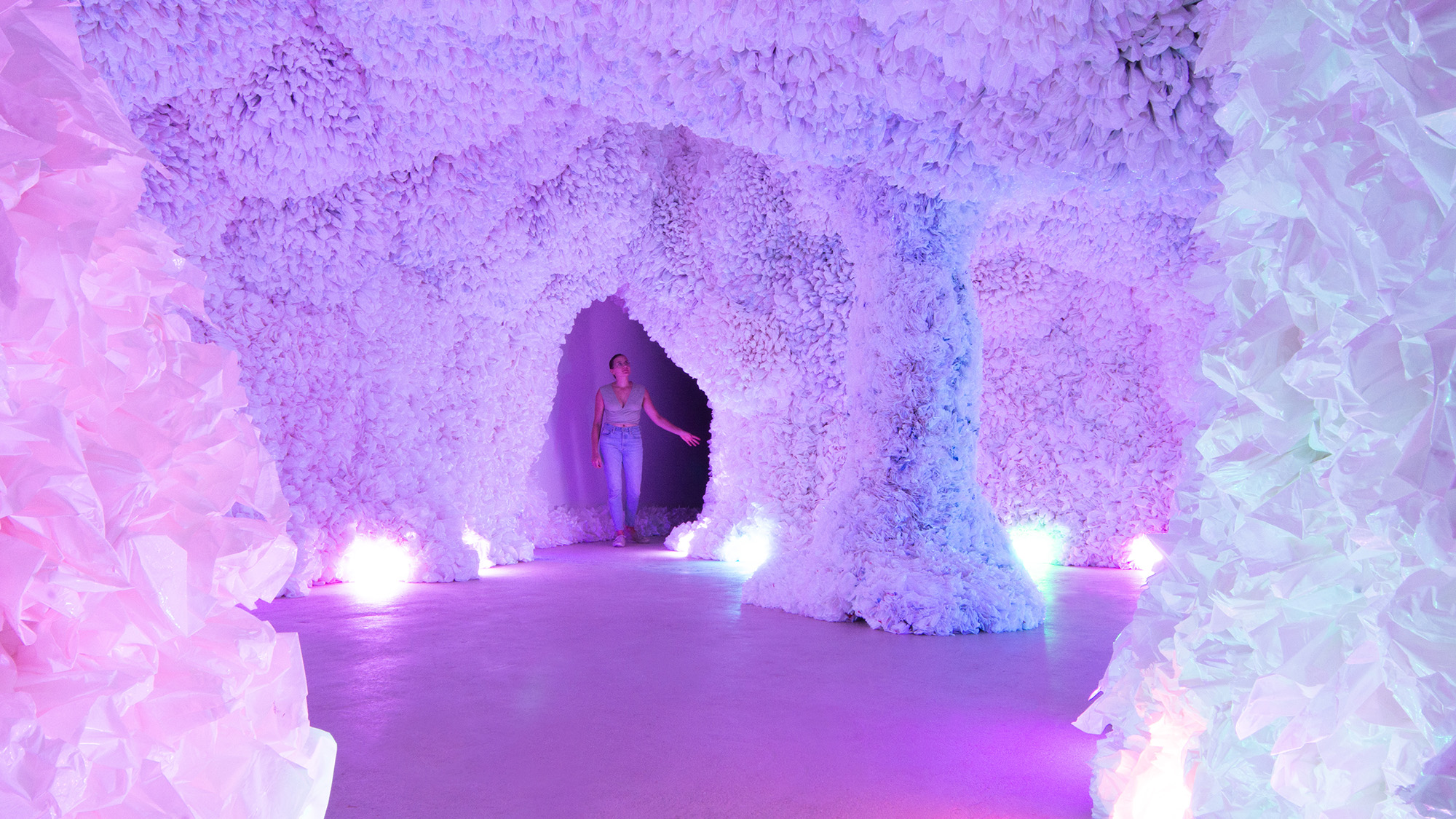 Woman walking through Hopscotch immersive exhibit.