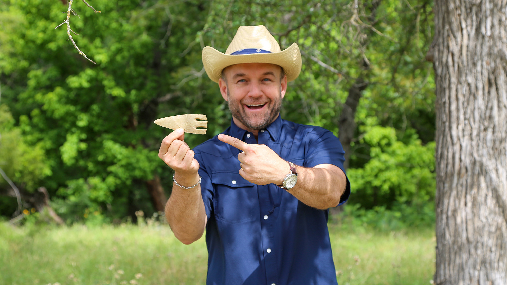 Chet Garner holding a "Clovis point" arrowhead.