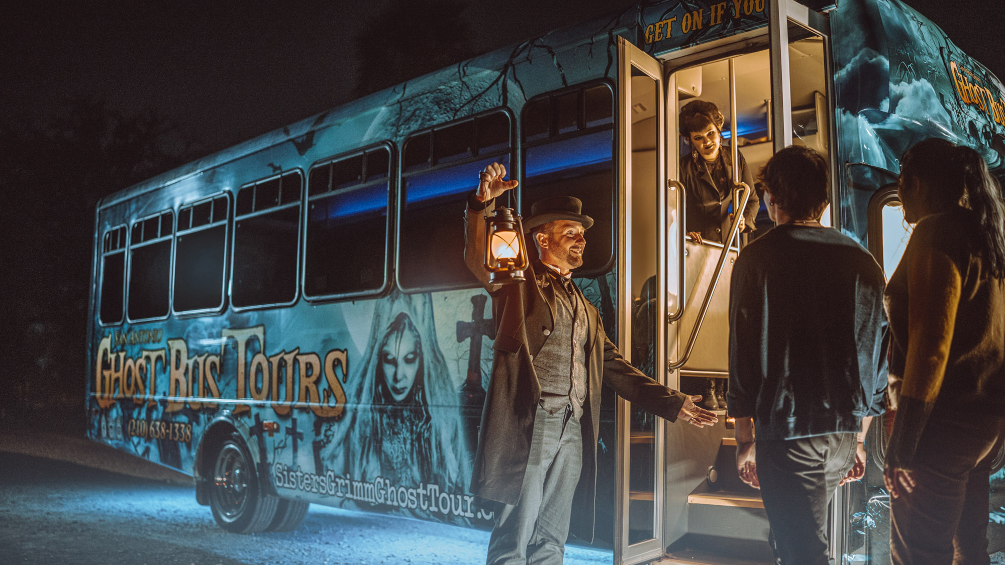 Man and woman getting on a ghost tour bus.