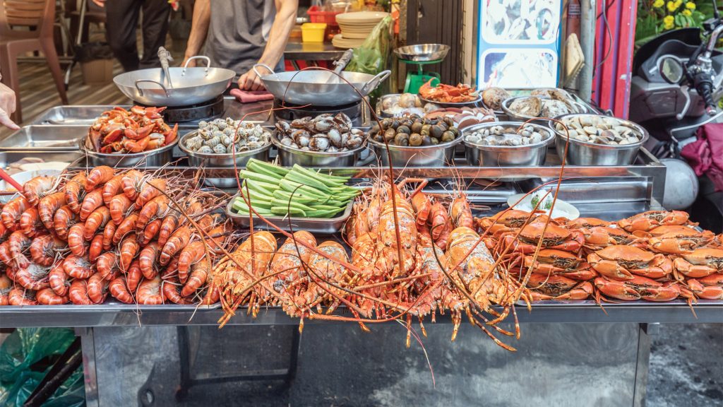 Crawfish being sold on a table.