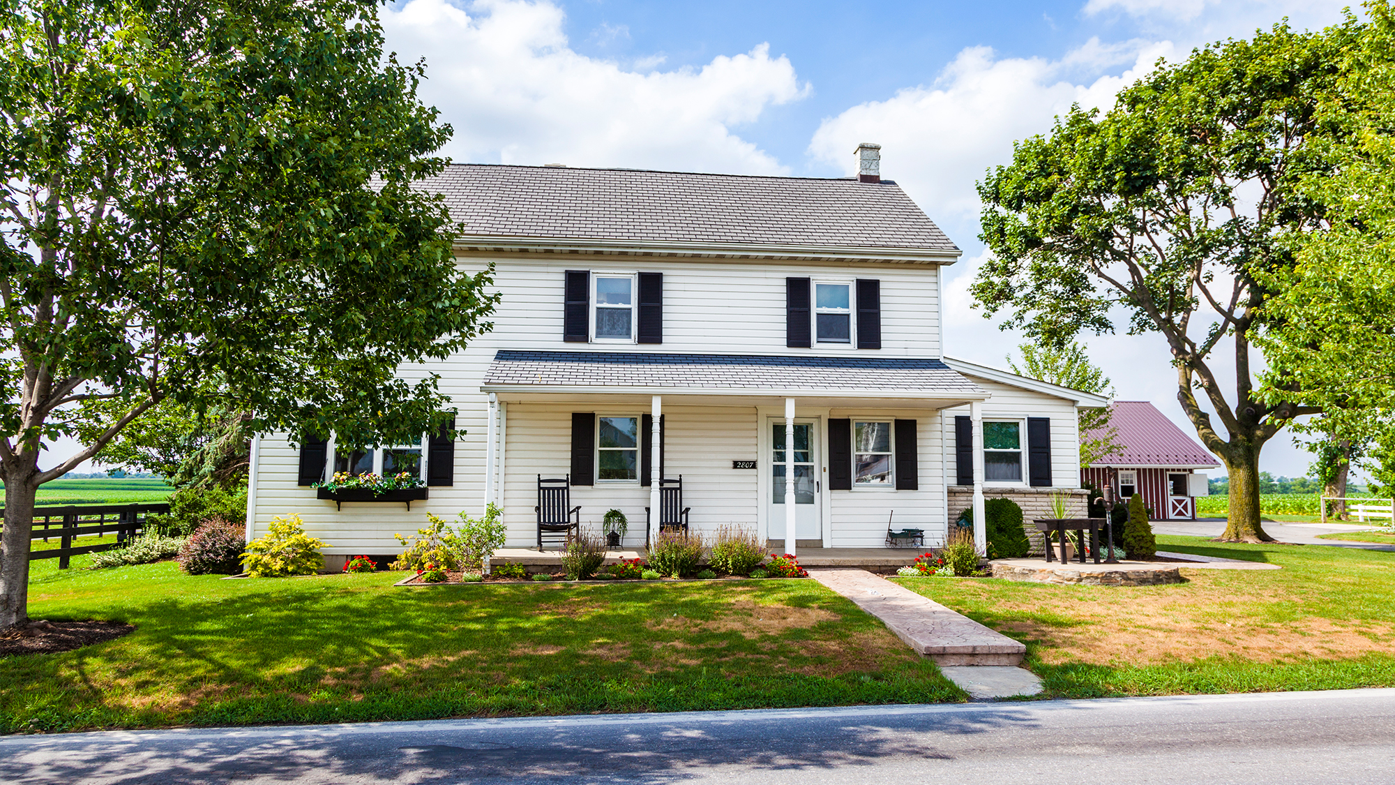 White house with dark roof.