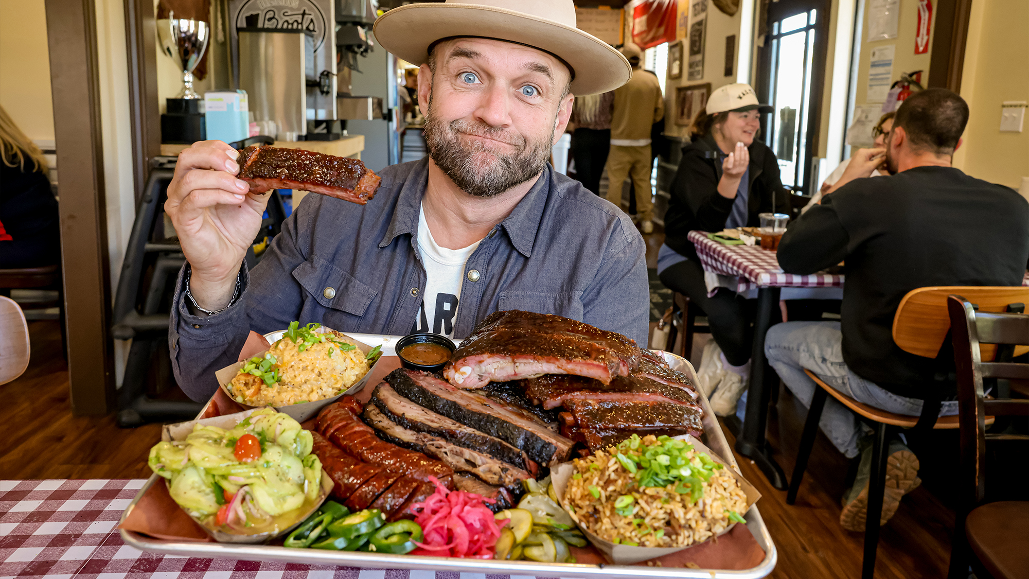 Chet Garner eating a plate of barbecue.
