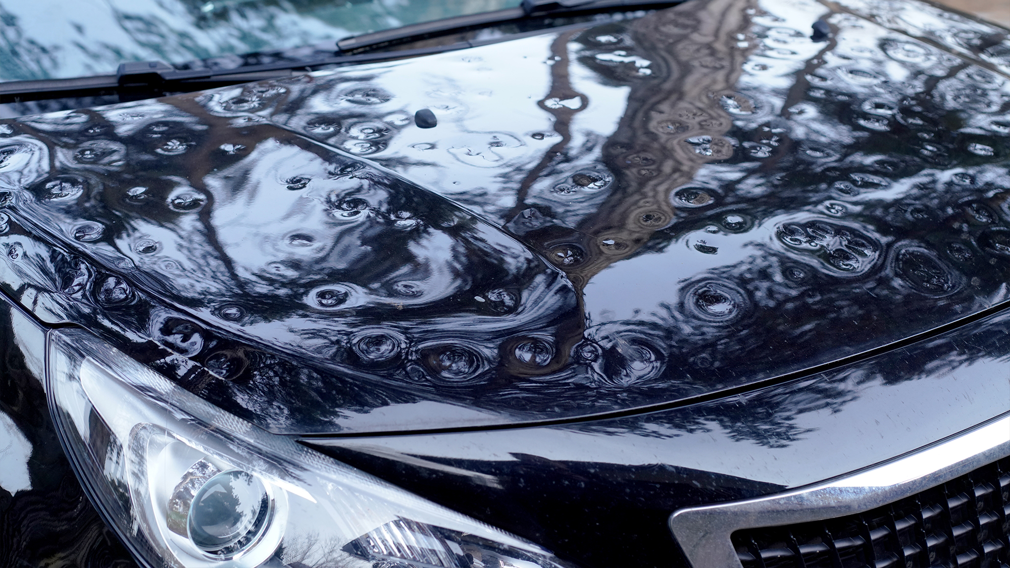 Car with dented hood.