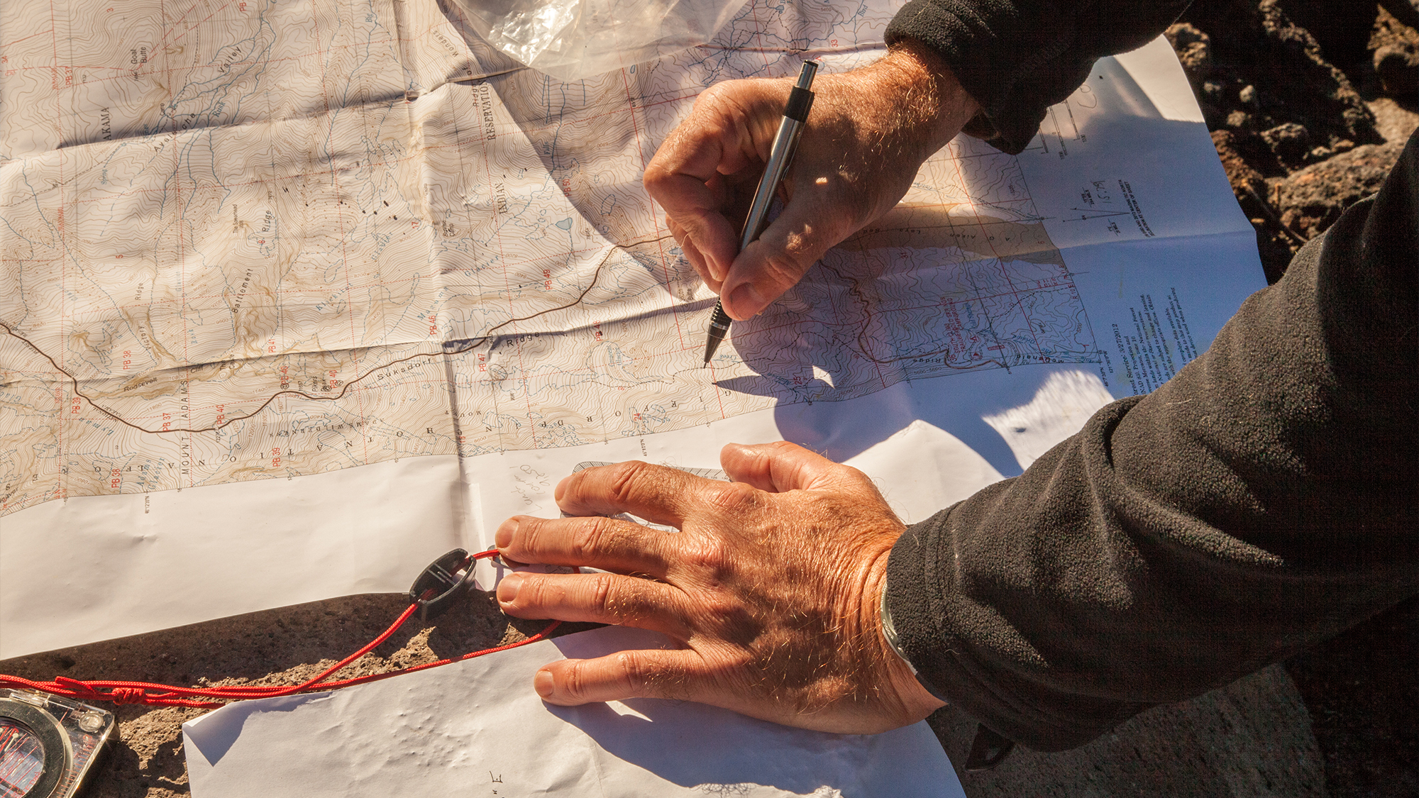 Person planning a map.