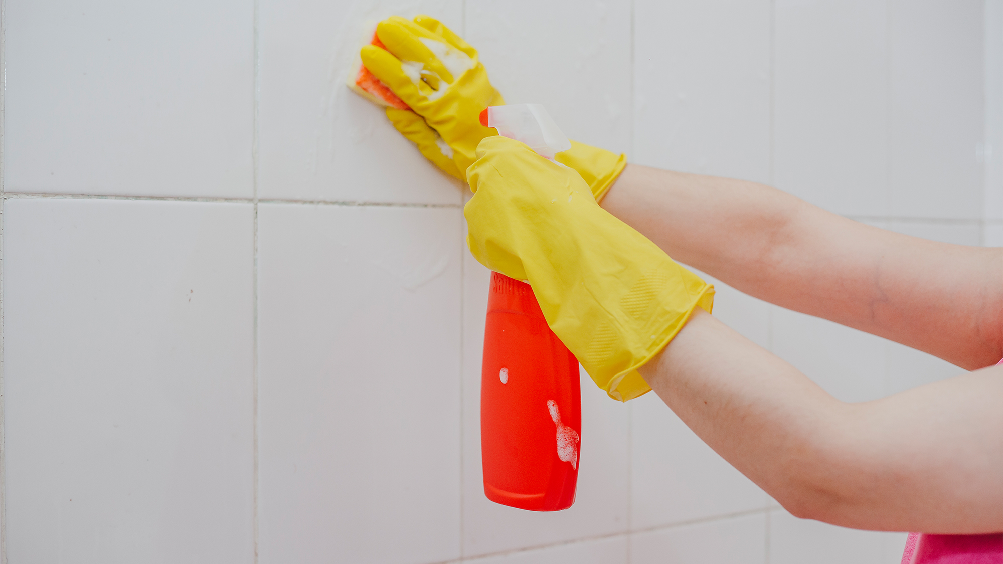 Person cleaning grout.