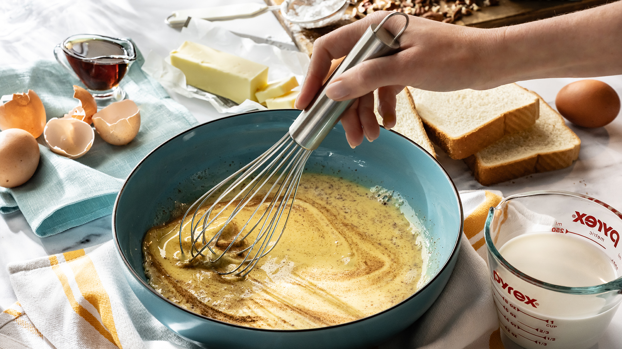Person making French toast.