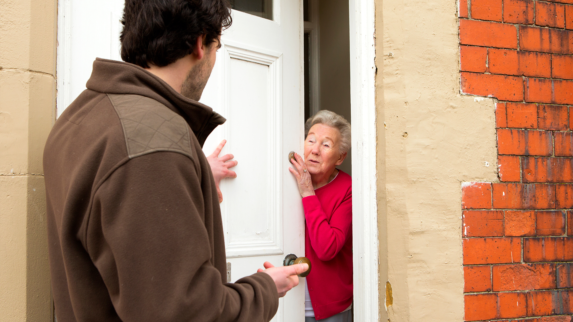Man checking on elderly neighbor.