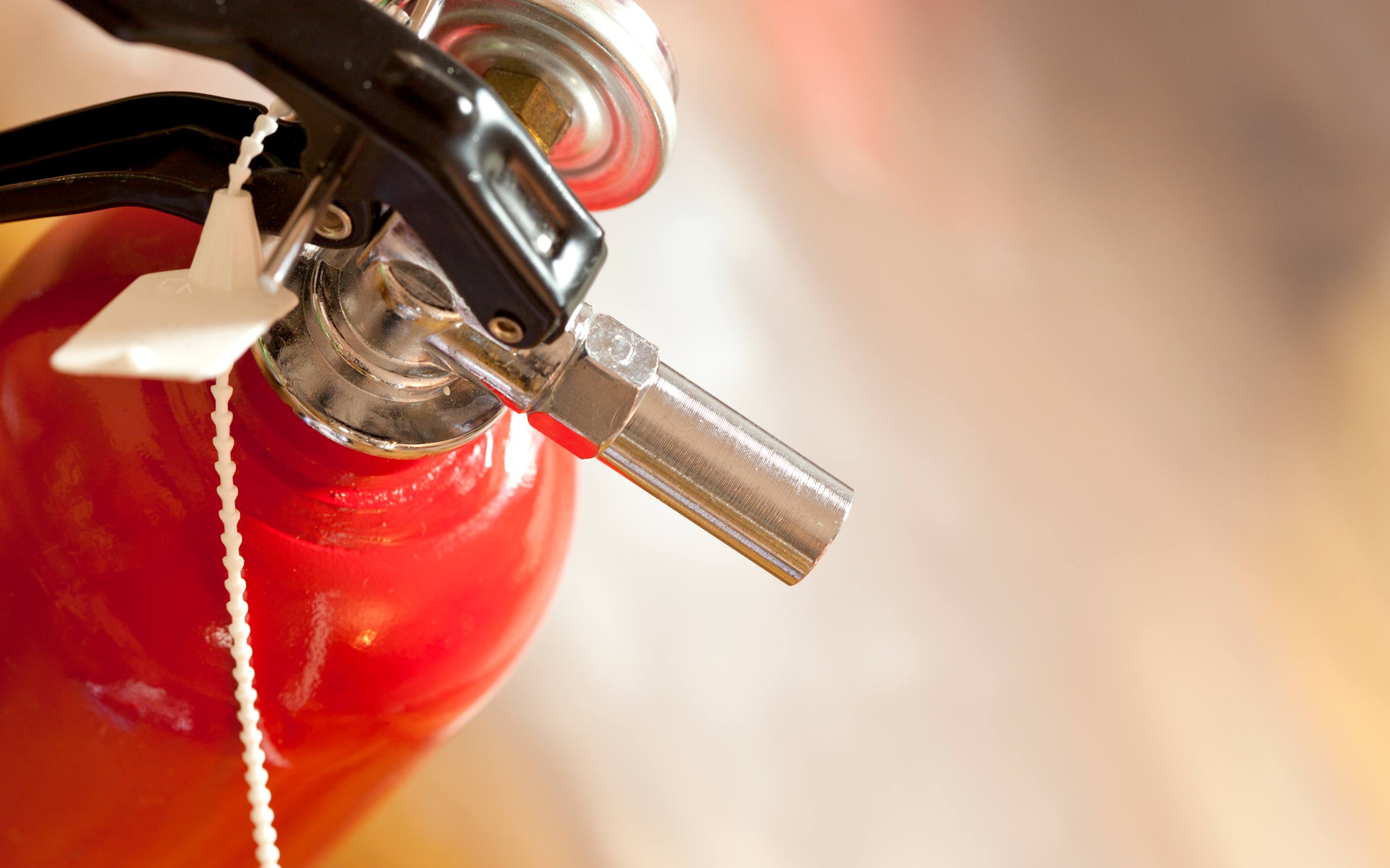 Close up of a fire extinguisher.