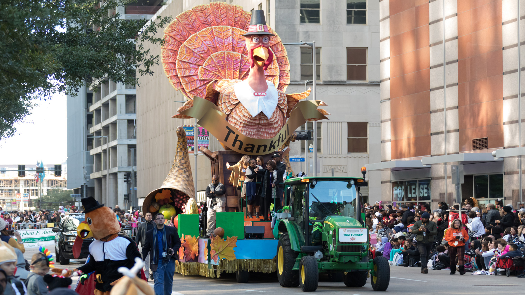 Thanksgiving parade with a turkey float.