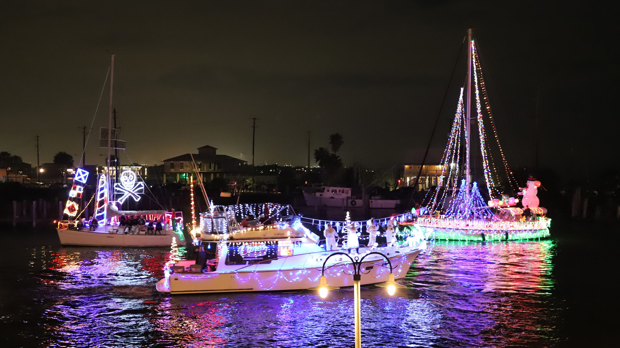 Boats decked out in holiday lights on the water in Kemah.