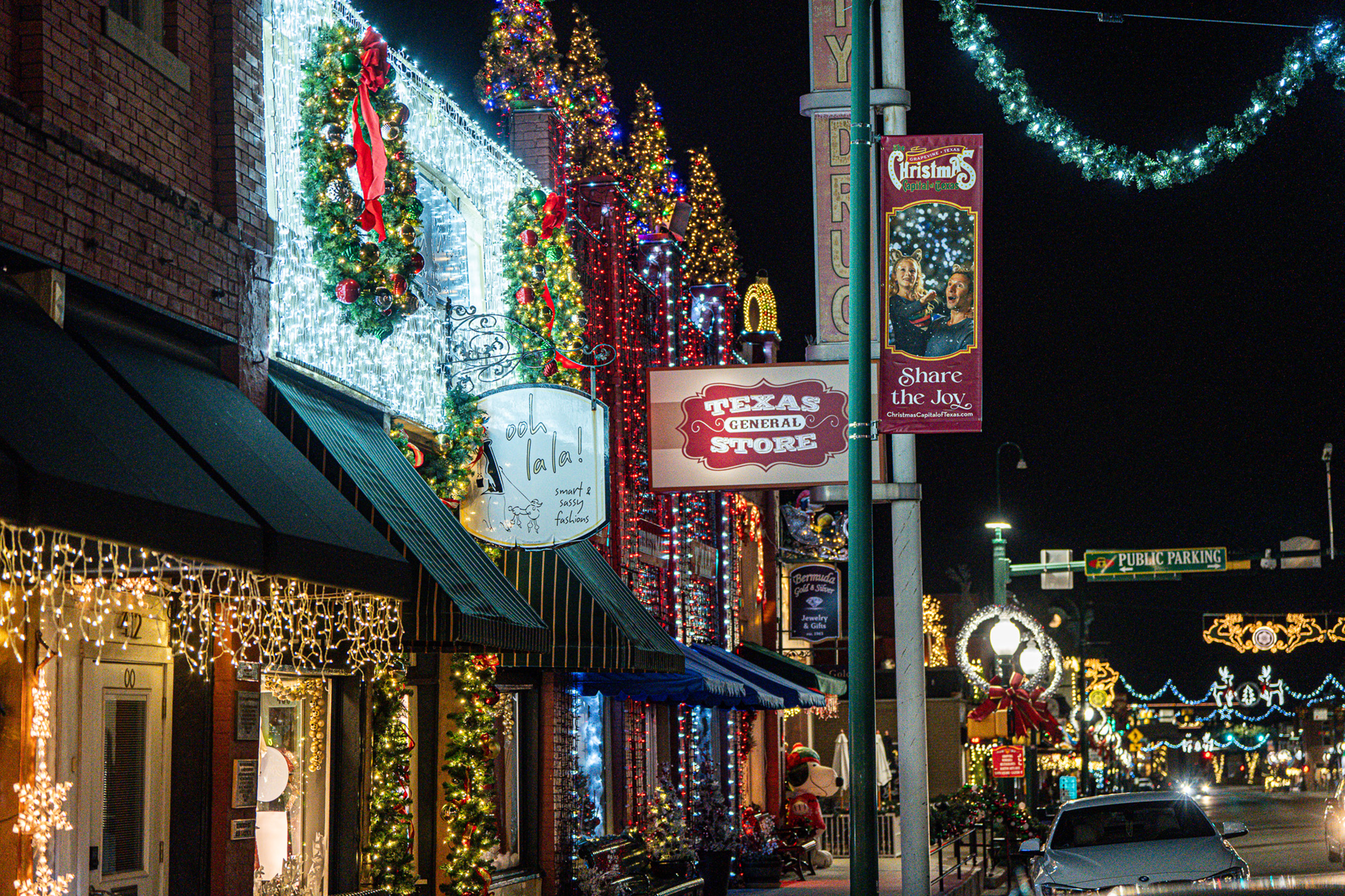 Shopping street decked out in Christmas lights and decorations.