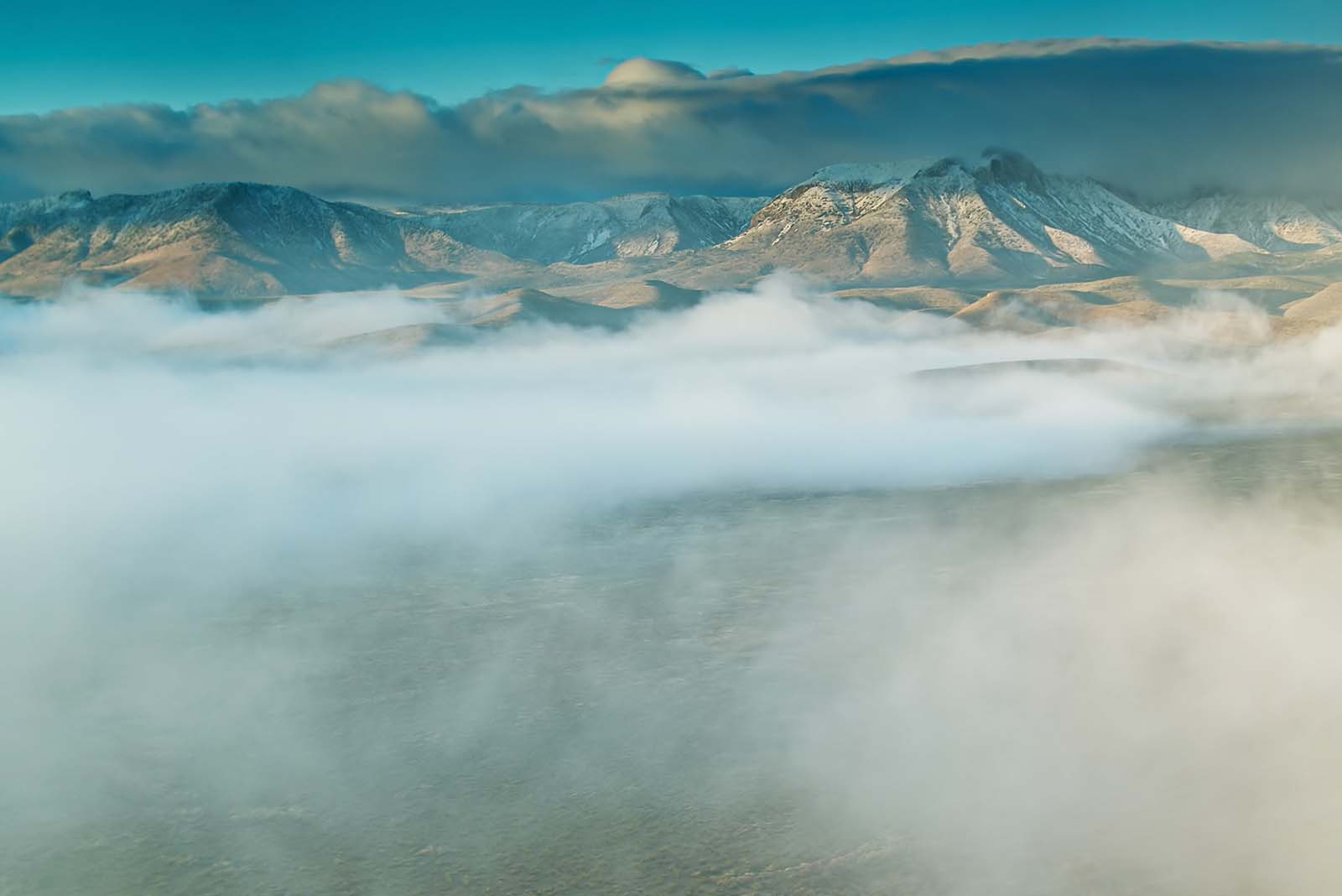 Aerial view of mountains and clouds.