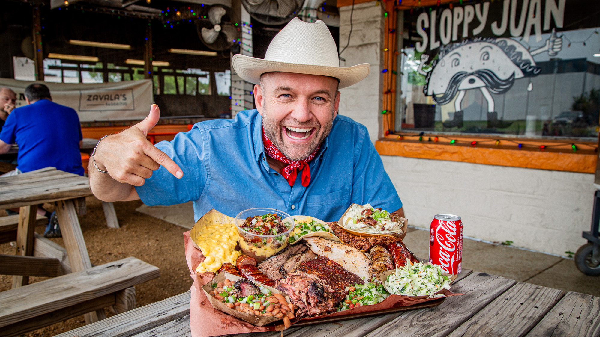 Chet Garner eating a platter of barbecue.