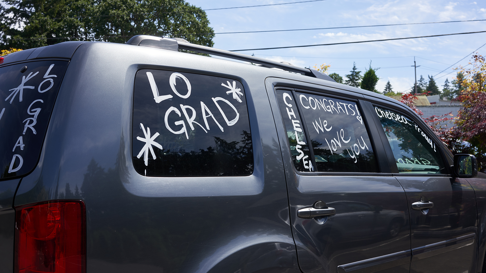 Car decorated with graduation paint.