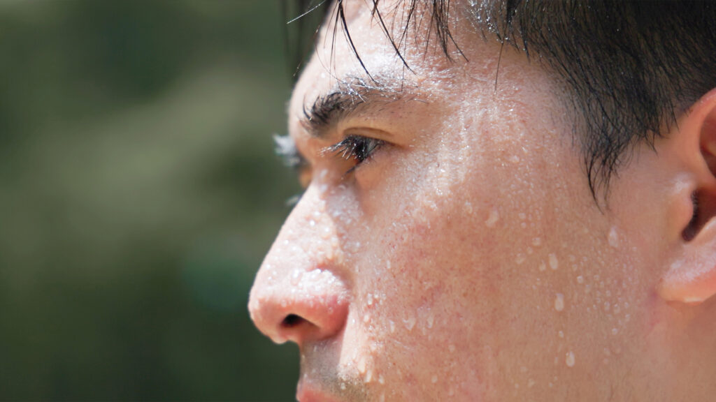 Man who has sweat on his face.