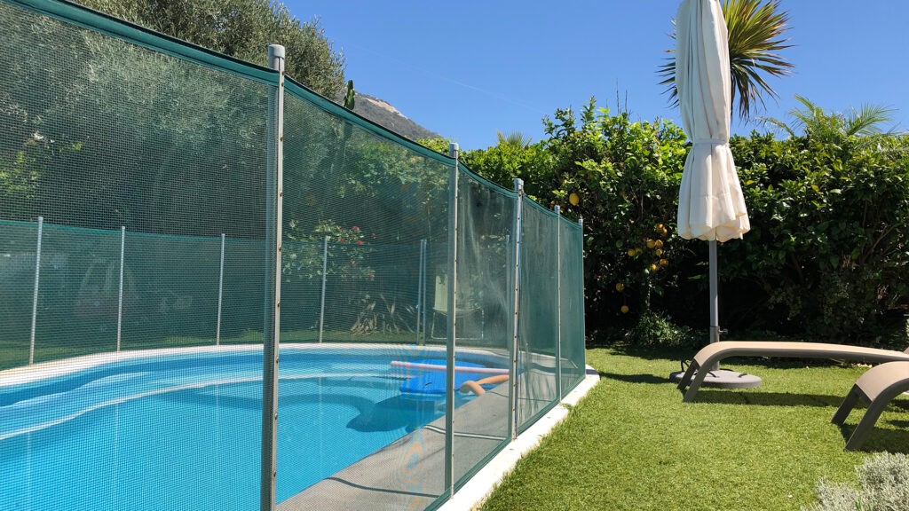 Pool with a large gate around it.