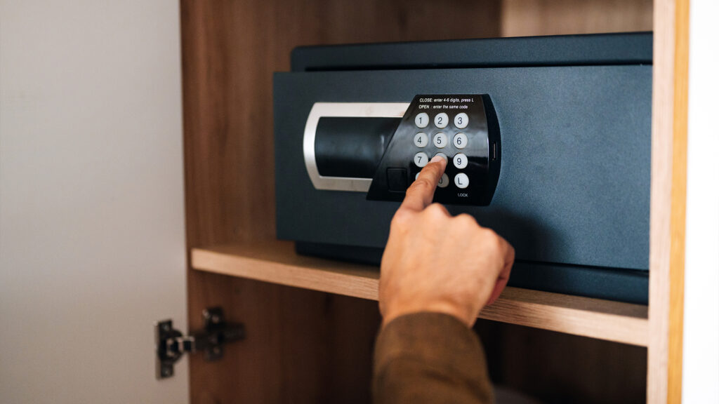 Person opening safe.