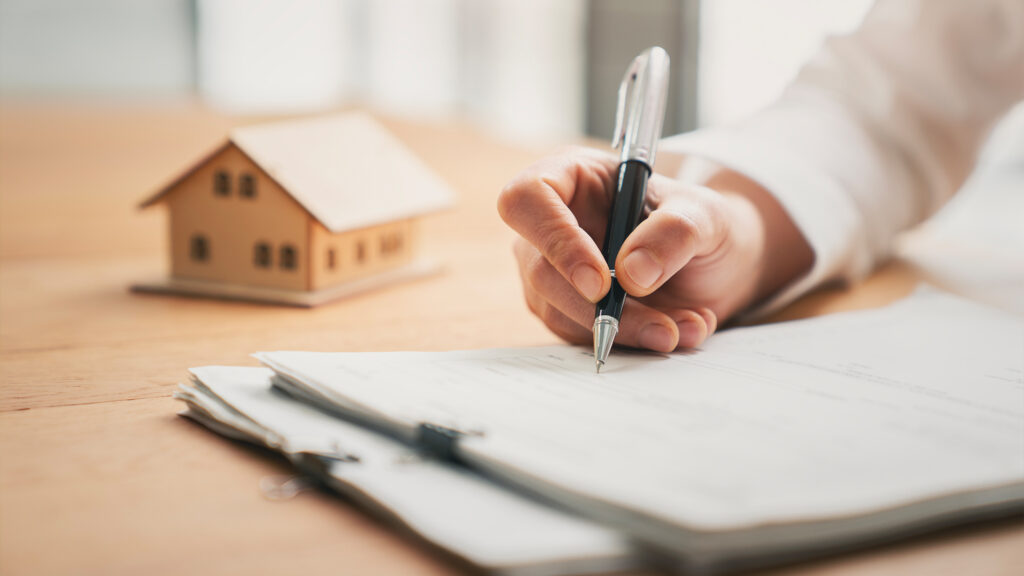Person writing in documents.
