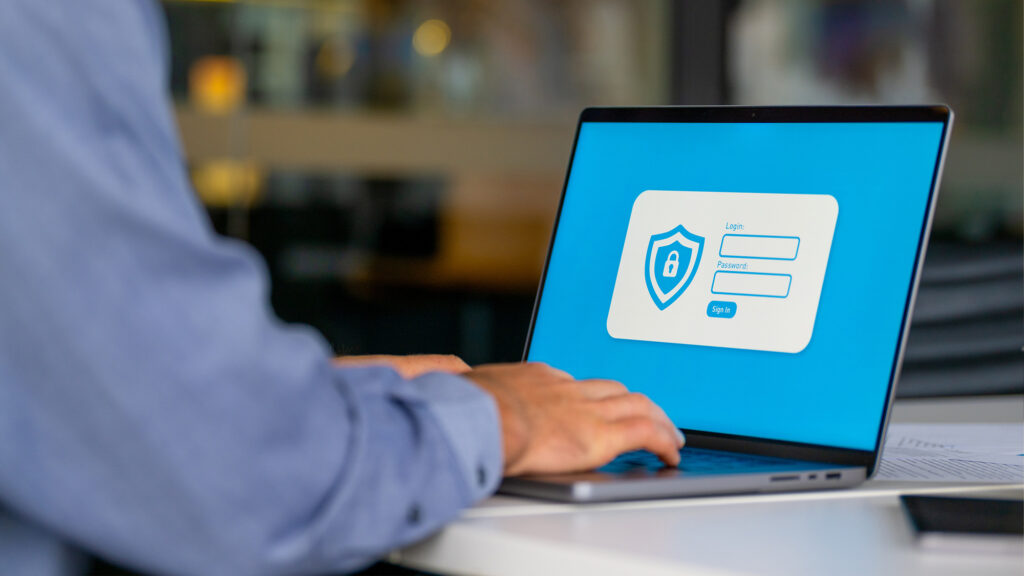 Person logging into a computer.