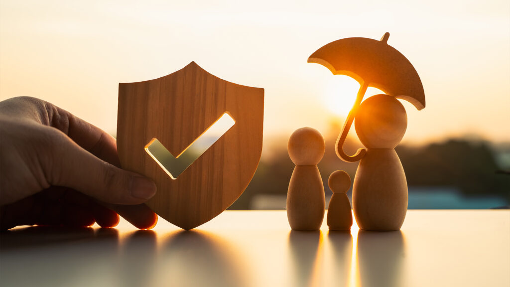 Wooden people figures and a check mark.