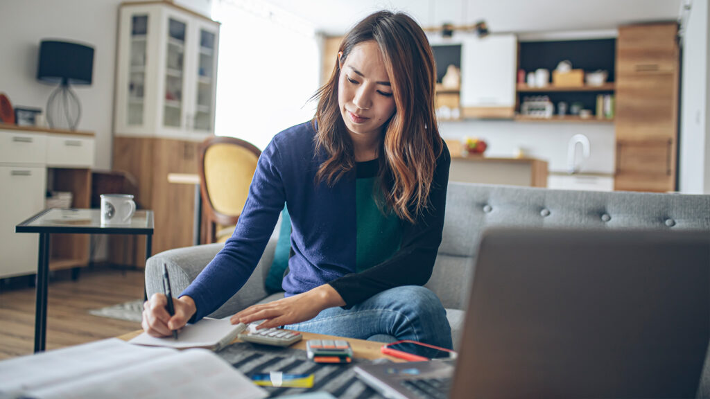 Person calculating finances.