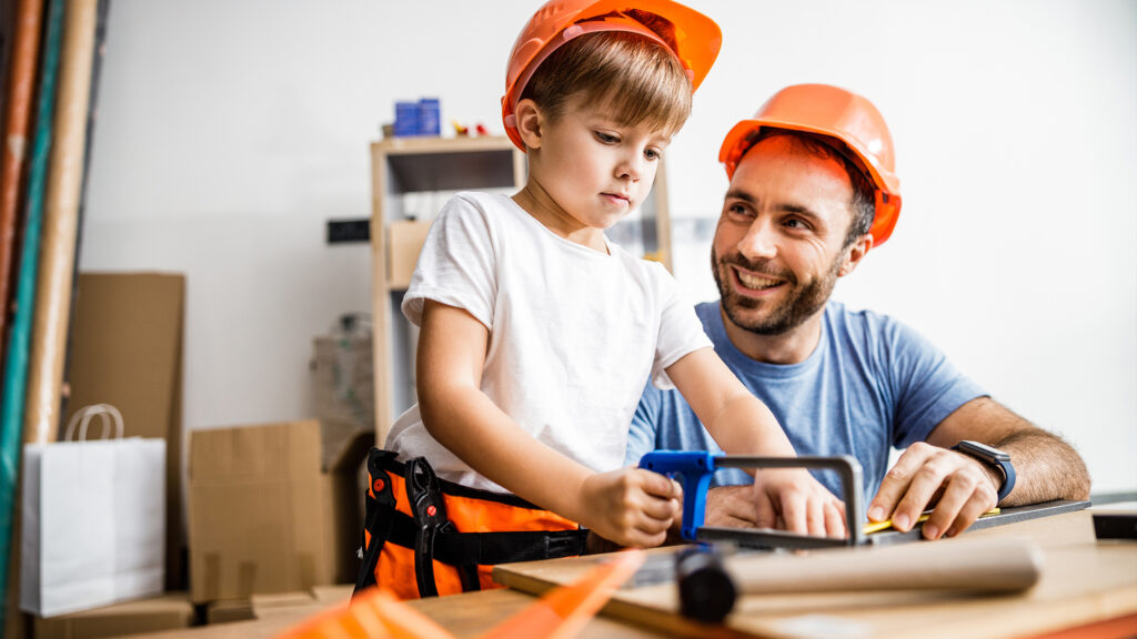 Man and kid building together.