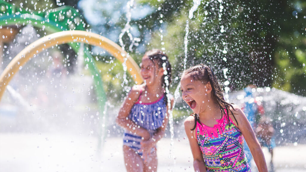 Kids playing at a splash pad.