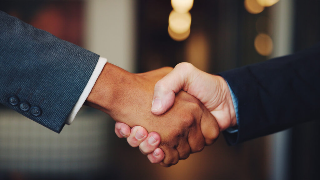 Two people shaking hands.