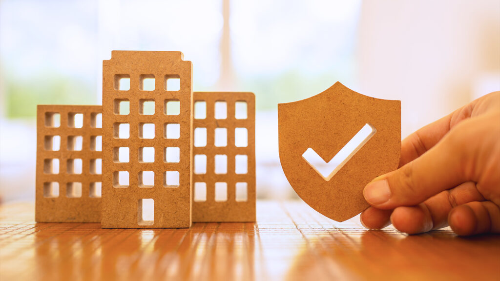 Toy building with a checkmark next to it.