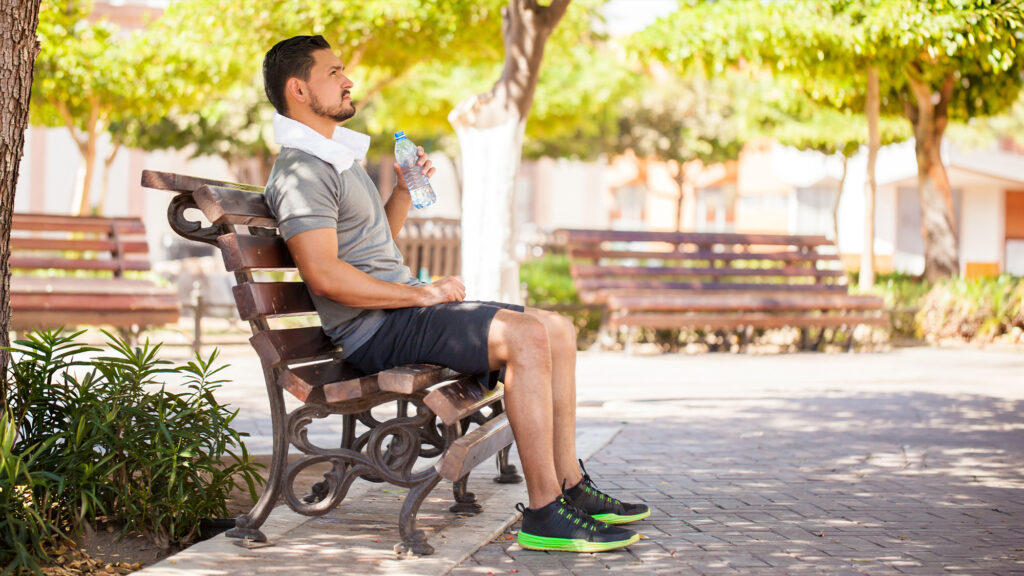 Person resting on a bench.