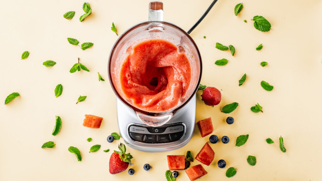 Blender blending watermelon and mint.