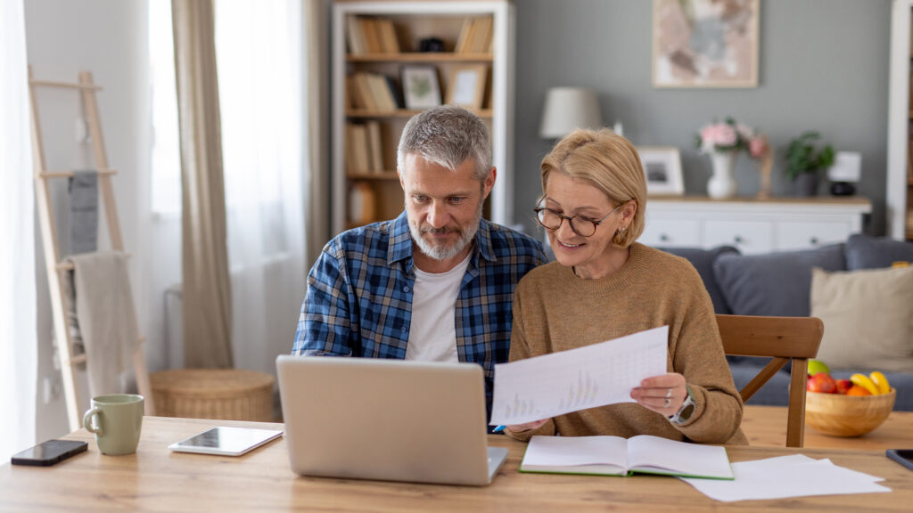 Older couple working on documents.